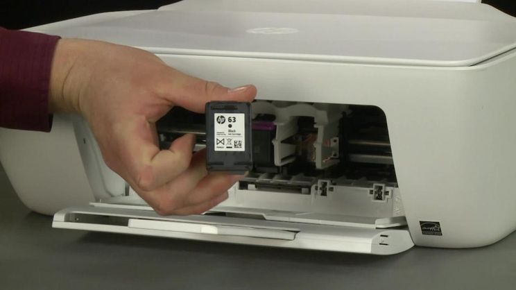 An HP deskjet 1510 printer with spare cartridges